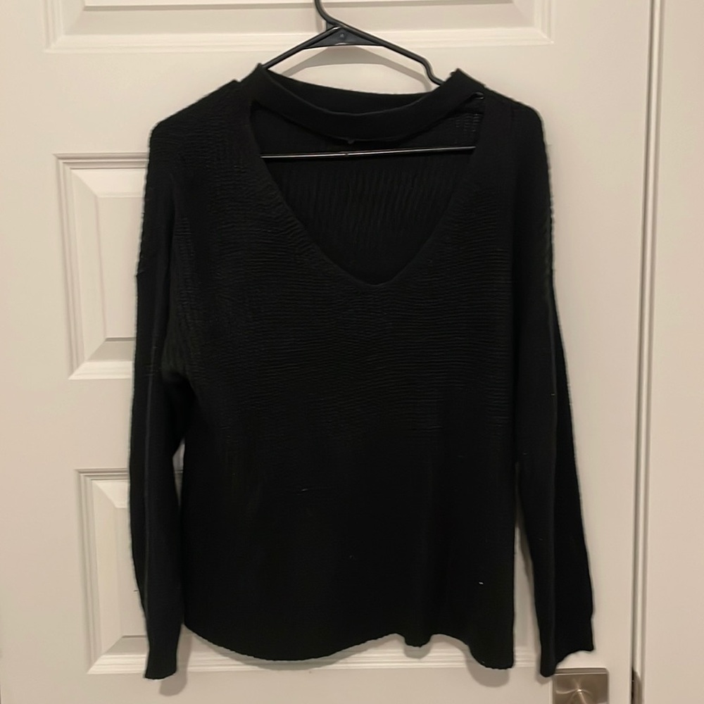Black knit sweater with cut out on chest